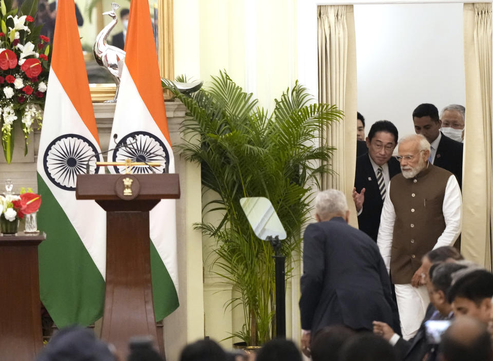 Indian Prime Minister Narendra Modi, right, with his Japanese counterpart Fumio Kishida arrive to make a press statement after their meeting in New Delhi, India, Monday, March 20, 2023. (AP Photo/Manish Swarup)