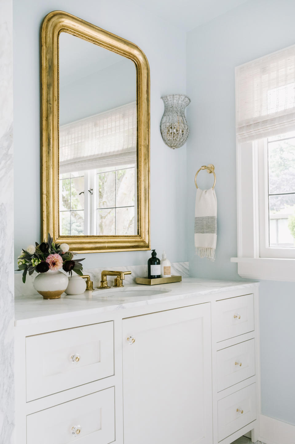 <p> With so many bathroom vanity ideas available, it can be hard to find the right fit for your space. &#x2018;A great way to refresh a tired bathroom is to opt for a vanity that looks like furniture, such as this dresser inspired vanity. Opt for a design that extends all the way to the side wall to ensure the maximum amount of usable counter space. Adding a mirror wall with sconces mounted above the vanity ensures plenty of reflected light,&#x2019; says Kristina Phillips. </p>