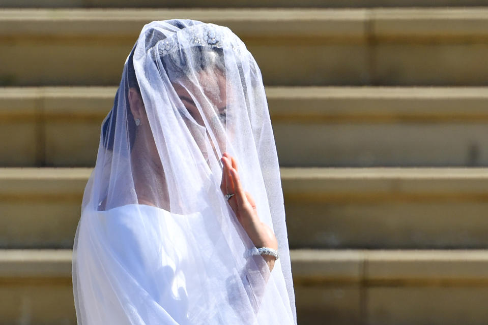 <p>Former actress Meghan Markle waves as she arrives for her wedding ceremony to marry Prince Harry, Duke of Sussex. (Photo: Ben Stansall/AFP/Getty Images) </p>