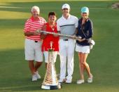 Golf - DP World Tour Championship - Jumeirah Golf Estates, Dubai, United Arab Emirates - 22/11/15 Northern Ireland's Rory McIlroy celebrates his Father Gerry, Mother Rosie and girlfriend Erica Stoll after winning The Race to Dubai and DP World Tour Championship Action Images via Reuters / Paul Childs Livepic