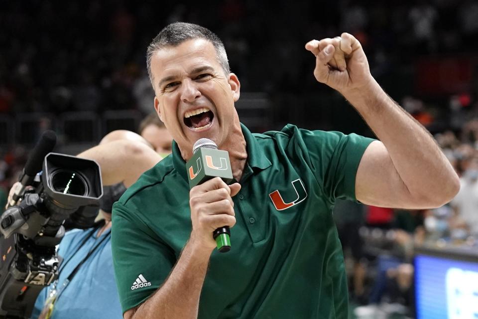 Miami head football coach Mario Cristobal firing up the crowd at the Miami-Florida State basketball game  Jan. 22. (AP Photo/Lynne Sladky)