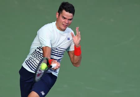 Aug 18, 2016; Mason, OH, USA; Milos Raonic (CAN) returns a shot against Yuchi Sugita (JPN) on day six during the Western and Southern tennis tournament at Linder Family Tennis Center. Mandatory Credit: Aaron Doster-USA TODAY Sports