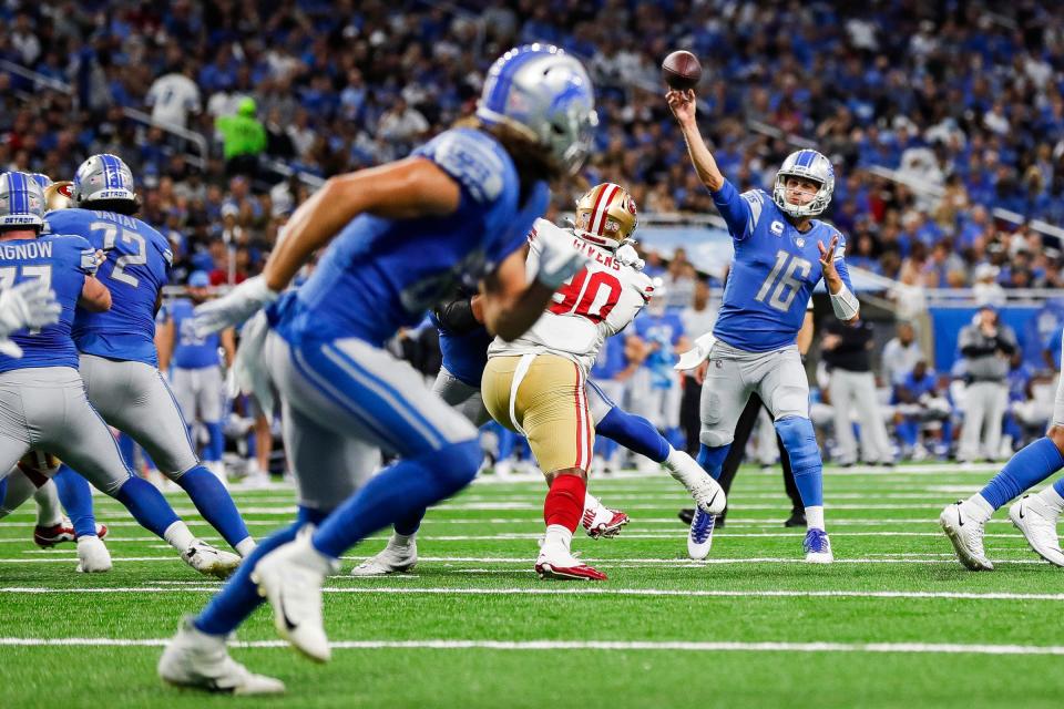 Detroit Lions quarterback Jared Goff throws a touchdown pass to tight end T.J. Hockenson against the San Francisco 49ers during the first half at Ford Field in Detroit on Sunday, Sept. 12, 2021.