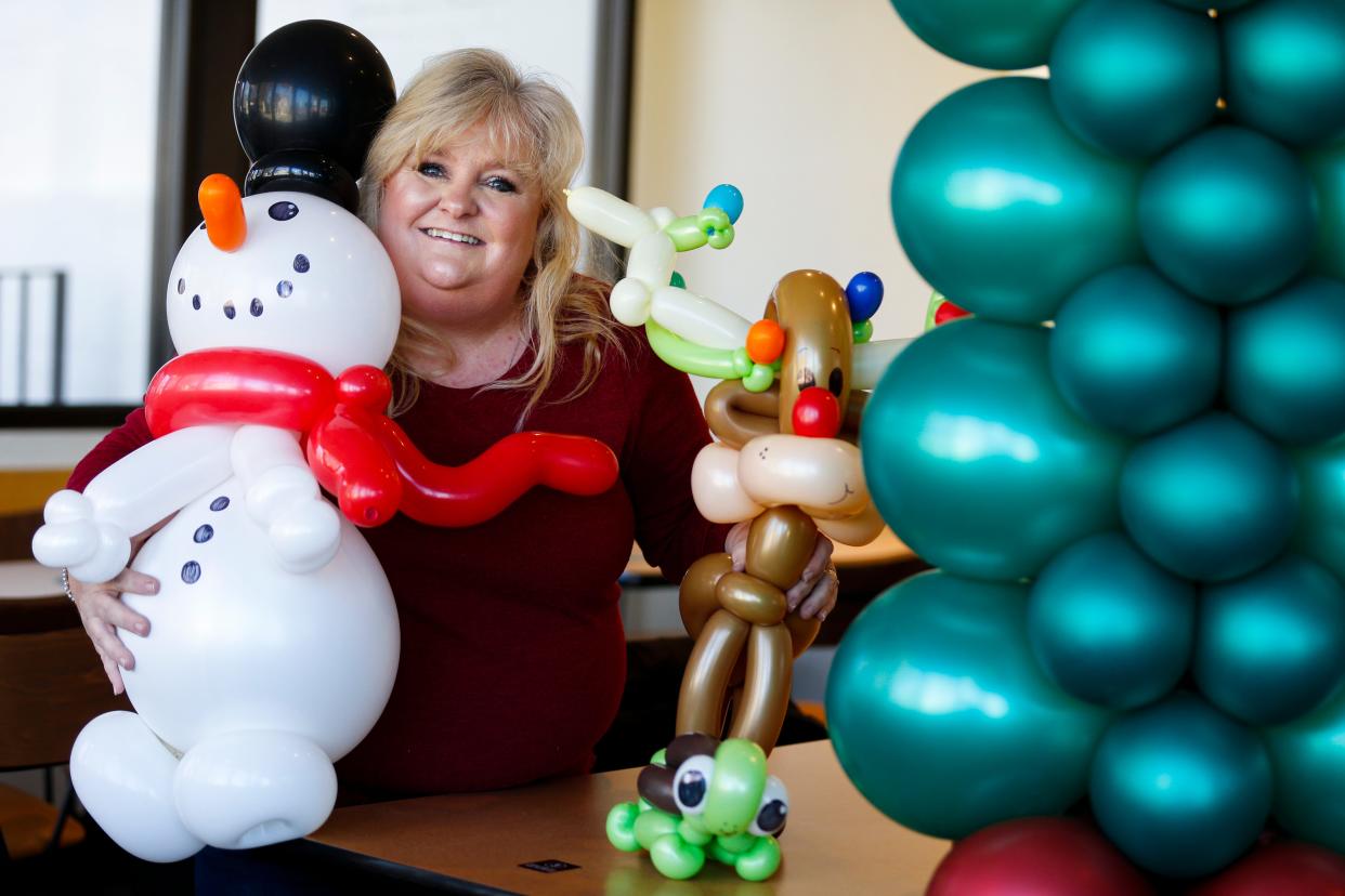 Dena Atchley, also known as The Balloon Lady in Springfield, with some of her balloon creations on Monday, Nov. 21, 2022. Atchley was selected for a leadership role at Big Balloon Build in KC, an international balloon festival.