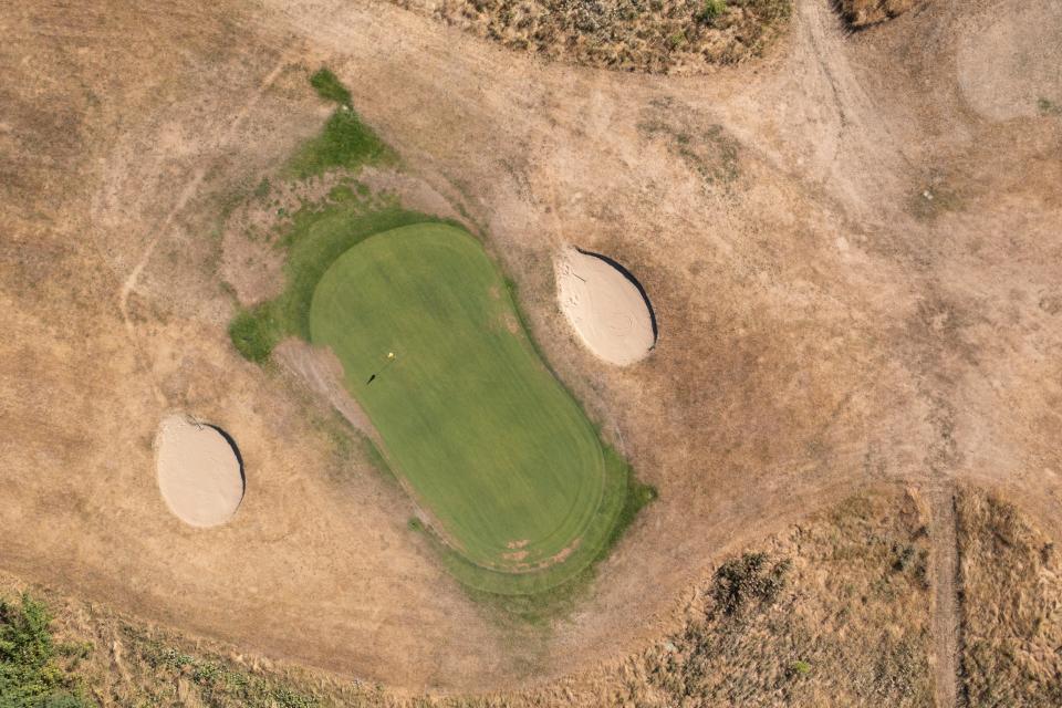 Greens surrounded by dry grass at Chelsfield Lakes golf club, in Orpington (Dan Kitwood/Getty Images)