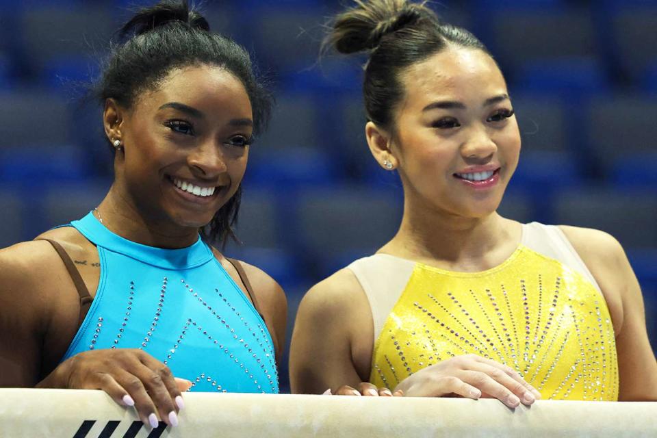 <p>Charly Triballeau/AFP/Getty</p> Simone Biles and Suni Lee