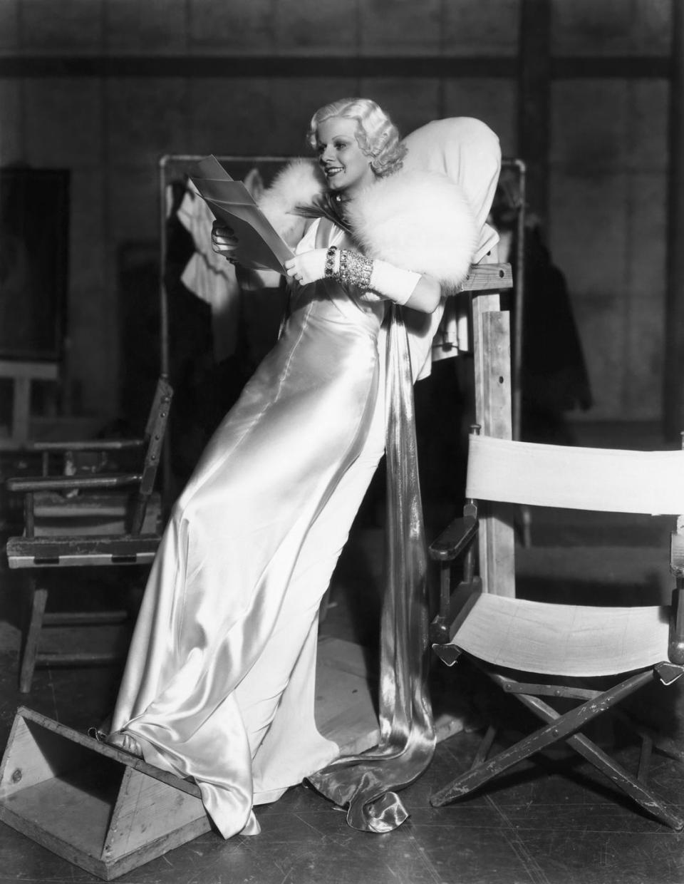 <p>Audiences expected Jean Harlow to bring the glamour while starring in <em>Dinner at Eight</em> as a sultry, social climbing wife. The film star delivered, showing off a wrist stacked with four diamond and gemstone bracelets, laid over a white satin glove. The art deco jewels were the perfect compliment to the iconic ensemble that Harlow is remembered for. </p>