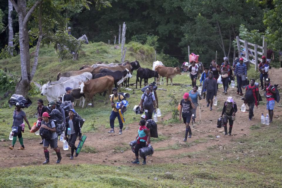 Haitian migrants continue their trek north, in Acandi, Colombia, Wednesday, Sept. 15, 2021. The migrants, following a well-beaten, multi-nation journey towards the U.S., will continue their journey through the jungle known as the Darien Gap. (AP Photo/Fernando Vergara)