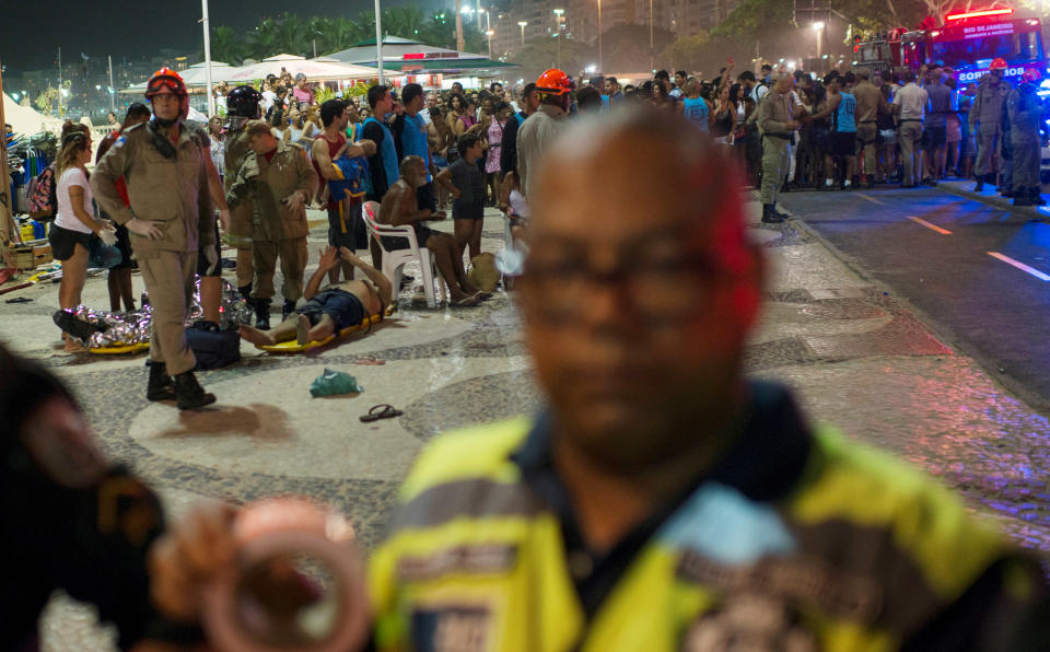 <p>Paramedics help the injured after a vehicle ran over some people at Copacabana beach in Rio de Janeiro, Brazil, Jan. 18, 2018. (Photo: Sebastian Rocandio/Reuters) </p>