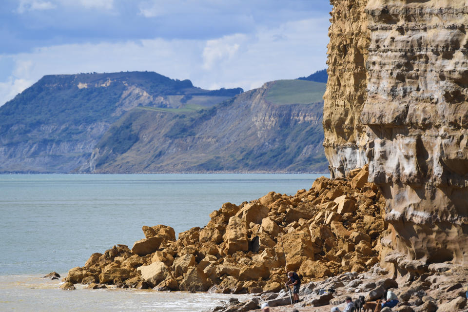 BURTON BRADSTOCK, UNITED KINGDOM - AUGUST 29: General view of the 9,000 ton cliff fall on August 29, 2020 in Burton Bradstock, Dorset, England. The fall happened at Hive Beach near the village of Burton Bradstock shortly before 06:30 BST, Dorset Council said. Fire crews using thermal imaging equipment were called in to check for any trapped casualties but nothing was found. The council described it as a "huge" rock fall and said recent heavy rain had made cliffs unstable. (Photo by Finnbarr Webster/Getty Images)