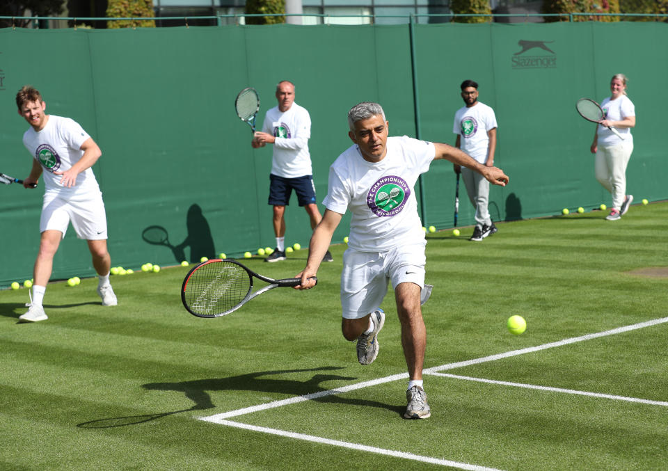 Mayor of London Sadiq Khan plays tennis with key workers at the All England Lawn Tennis Club in Wimbledon, south west London, during an event to thank members of the NHS, TfL and care workers for their service during the coronavirus pandemic.