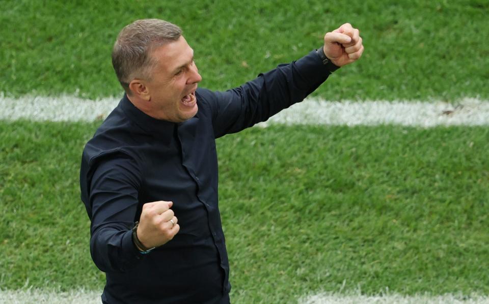 Serhiy Rebrov celebrates a crucial win for Ukraine.