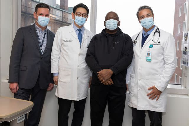 <p>Michelle Rose/Massachusetts General Hospital</p> Rick Slayman with his doctors.