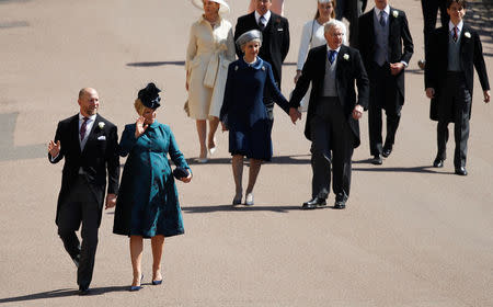 Zara Tindall (2L) and Mike Tindall (L) arrive ahead of Britain's Prince Richard, Duke of Gloucester, (top R) and Britain's Birgitte, Duchess of Gloucester, (top L) arrive for the wedding ceremony of Britain's Prince Harry, Duke of Sussex and US actress Meghan Markle at St George's Chapel, Windsor Castle, in Windsor, on May 19, 2018. Odd ANDERSEN/Pool via REUTERS