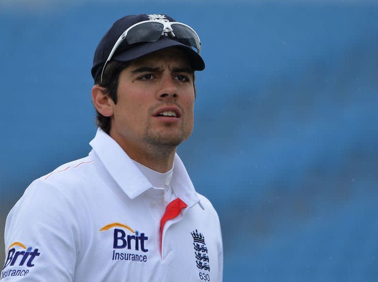 England's Alastair Cook leaves the field as rain falls during the fifth day's play in the second Test against New Zealand at Headingley in Leeds, on May 28, 2013. England have won the second and final Test against New Zealand by 247 runs at Headingley, to clinch a 2-0 series win