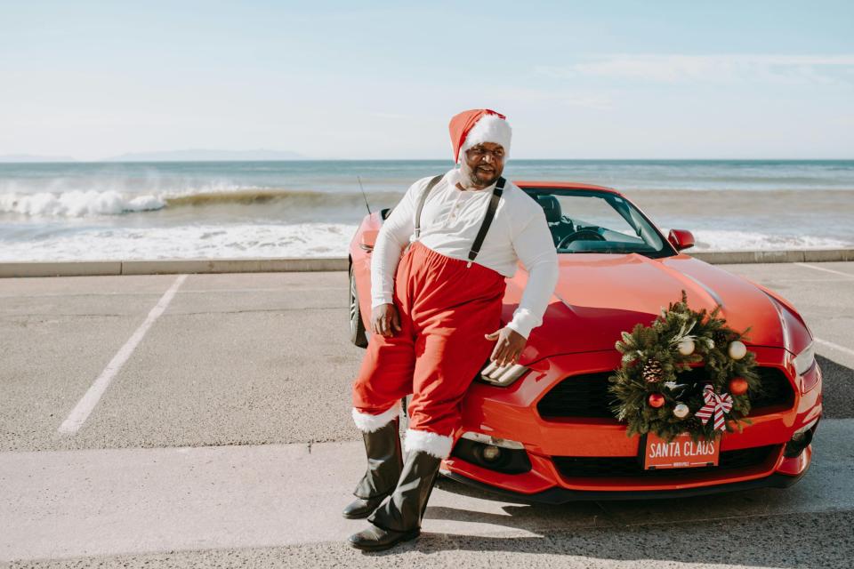 Christmas is why winter is the best time to visit Puerto Rico. 
pictured: a Black santa on the beach in Puerto Rico