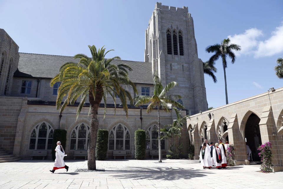 Clergy line up to enter for services at the Episcopal Church of Bethesda-by-the-Sea, where President Donald Trump and family are attending Easter services, Sunday, April 16, 2017, in Palm Beach, Fla. (AP Photo/Alex Brandon)