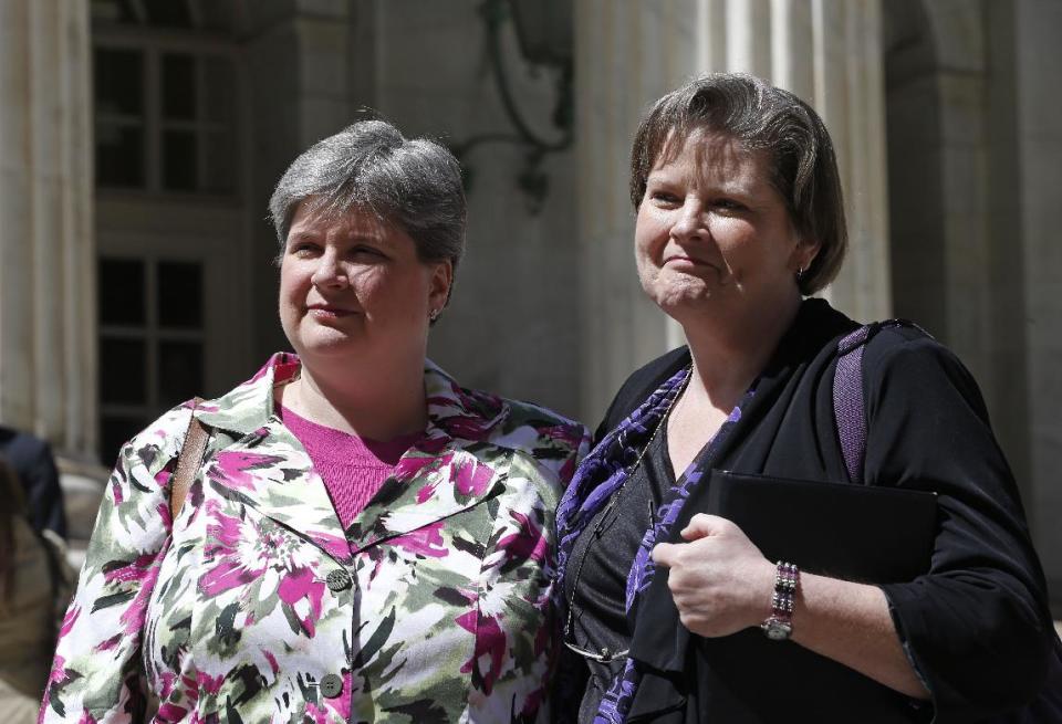 Plaintiffs challenging Oklahoma's gay marriage ban Sharon Baldwin, left, and her partner Mary Bishop leave court following a hearing at the 10th U.S. Circuit Court of Appeals in Denver, Thursday, April 17, 2014. The appeal of a lower court's January ruling that struck down Oklahoma's gay marriage ban is the second time the issue has reached appellate courts since the U.S. Supreme Court shook up the legal landscape last year by finding the federal Defense of Marriage Act was unconstitutional. (AP Photo/Brennan Linsley)