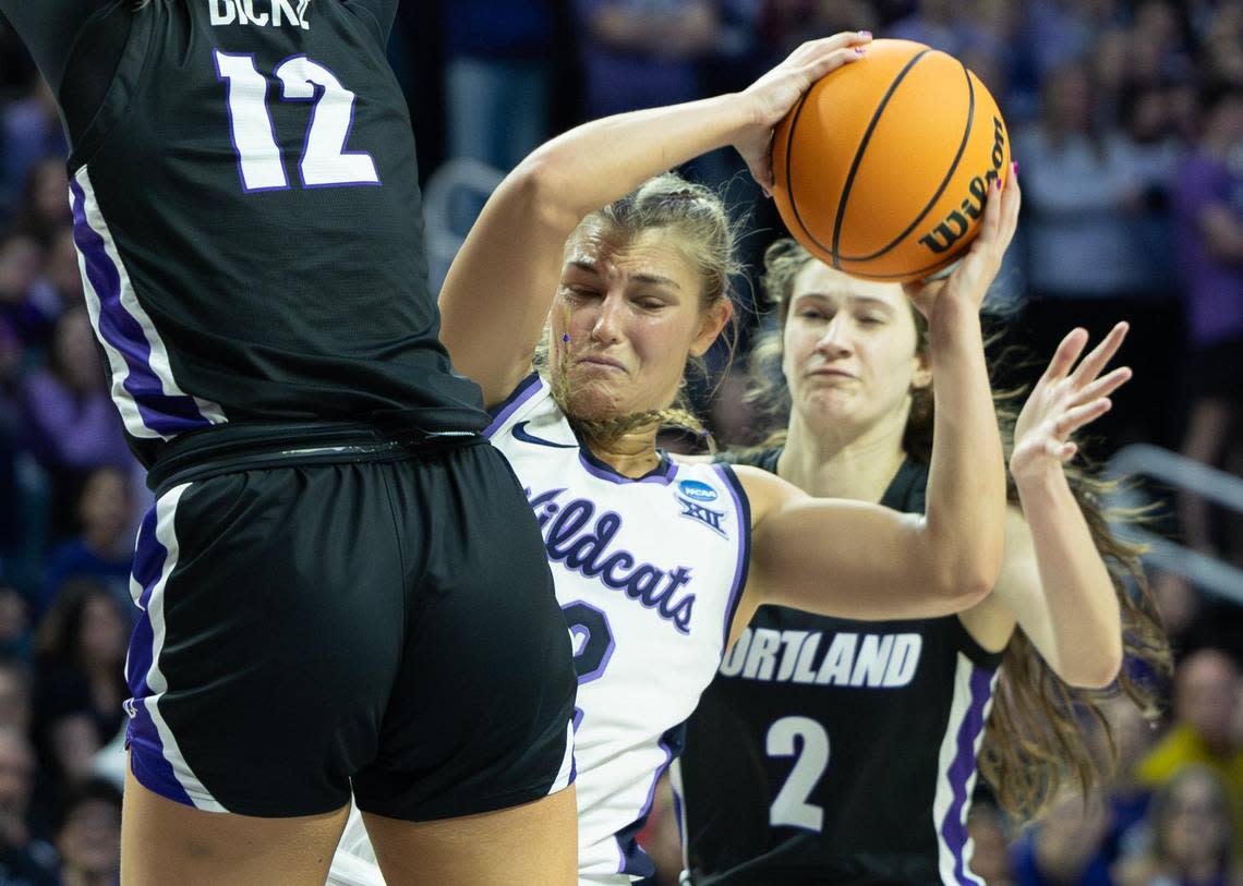 Kansas State’s Gabby Gregory gets squeezed between Portland defenders Kennedy Dickie, left, and Dani Ananiev during the third quarter of their NCAA Tournament game on Friday in Manhattan. Travis Heying/The Wichita Eagle