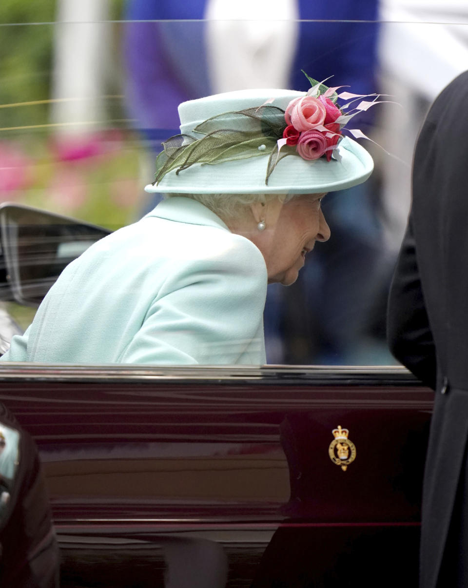 Britain's Queen Elizabeth II arrives by car during day five of of the Royal Ascot horserace meeting, at Ascot Racecourse, in Ascot, England, Saturday June 19, 2021. (Andrew Matthews/PA via AP)