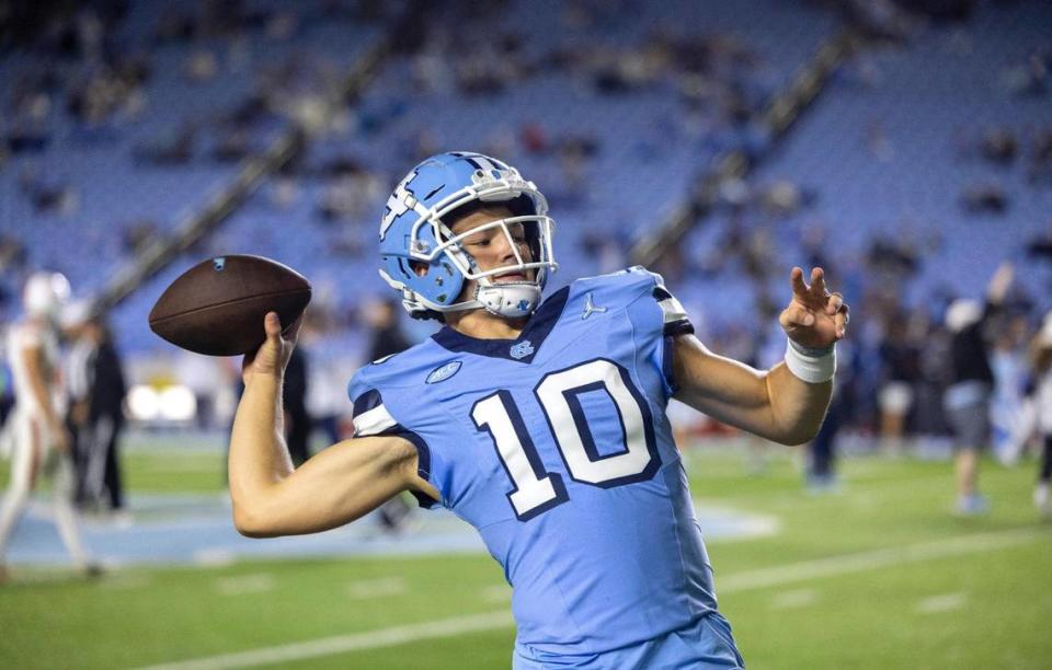 North Carolina quarterback Drake Maye (10) warms up for the Tar Heels’ game against Miami on Saturday, October 14, 2023 at Kenan Stadium in Chapel Hill, N.C.