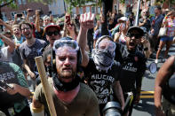 <p>Anti-fascist counter-protesters wait outside Lee Park to hurl insluts as white nationalists, neo-Nazis and members of the “alt-right” are forced out after the “Unite the Right” rally was declared an unlawful gathering Aug. 12, 2017 in Charlottesville, Va. (Photo: Chip Somodevilla/Getty Images) </p>