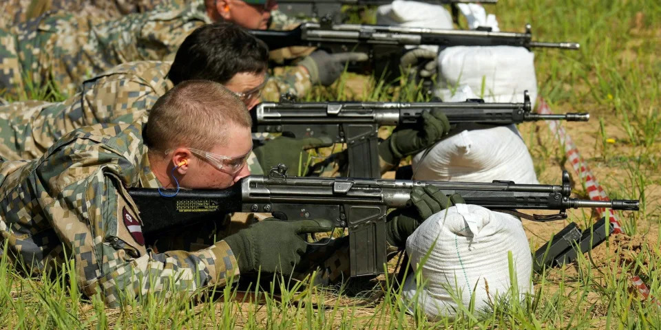 Members of Latvia's National Guard attend a shooting exercise during basic military training camp near Daugavpils, Latvia July 8, 2022.