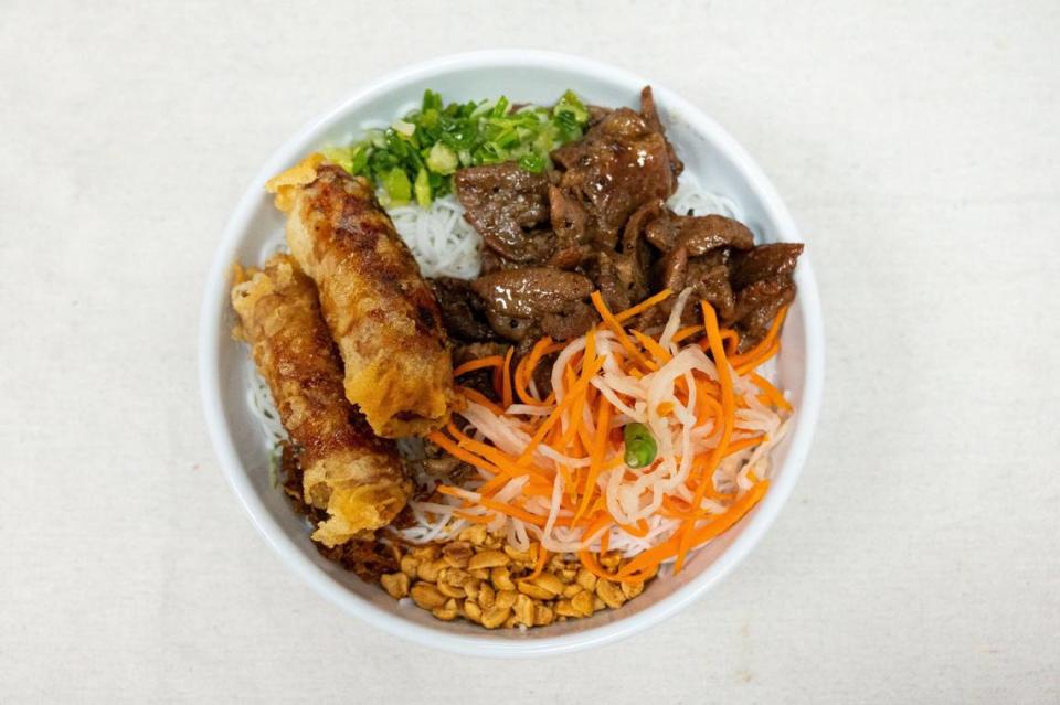 Bún thit nuong, cha gio is ready to serve at Com Tam Dat Thanh in south Sacramento on Thursday. The dish comes with rice vermicelli with barbecue pork, egg rolls, green onion, peanuts and pickled carrot and daikon.