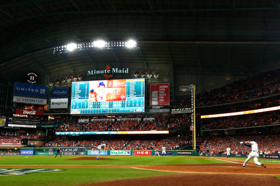 A Houston Astros fan was removed from their game on Saturday for holding up a domestic violence awareness sign in the stands. (Getty Images)