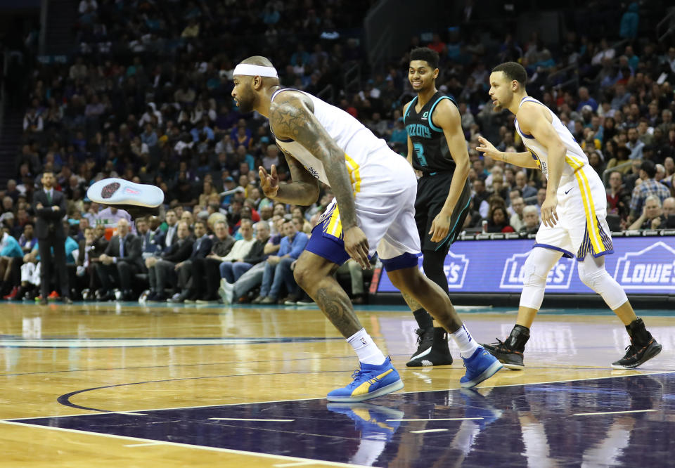 DeMarcus Cousins was not happy when officials called a technical foul when he threw a shoe into the stands.  (Getty)
