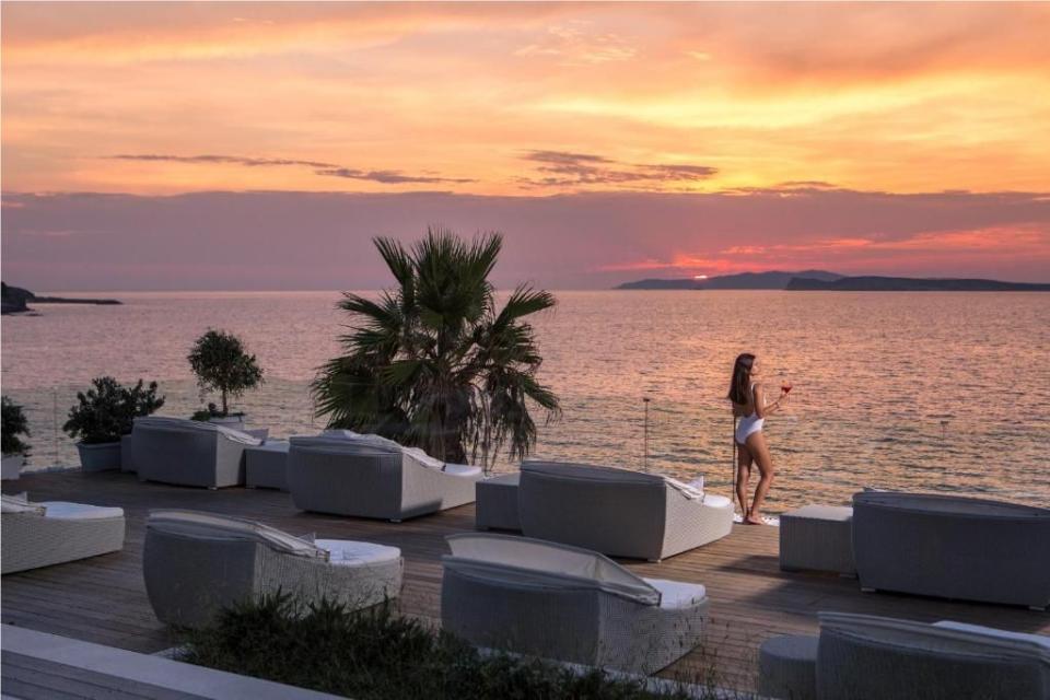 <p>Overlooking Agios Stefanos on the island's craggy northwest coast, this contemporary wellness hotel built into the cliff face offers some of the finest sunset views on Corfu. Set in lush tropical gardens, <a href="https://www.booking.com/hotel/gr/delfino-blu-boutique.en-gb.html?aid=1922306&label=best-hotels-greece" rel="nofollow noopener" target="_blank" data-ylk="slk:Delfino Blu Wellness Hotel;elm:context_link;itc:0;sec:content-canvas" class="link ">Delfino Blu Wellness Hotel</a> offers the choice of three pools, each overlooking the navy sweep of the Ionian Sea. However, the highlight is the luxe outdoor spa, where you can bathe in a crystal steam bath or book a natural thalassotherapy experience. </p><p>There are 15 rooms and suites, most have sea views, while some even have fireplace and a large terrace for lazy sundowners. Breakfast is a true Greek feast, complete with champagne, while dinner in Kohili is an elegant Mediterranean affair using local, seasonal produce.</p><p><a class="link " href="https://www.booking.com/hotel/gr/delfino-blu-boutique.en-gb.html?aid=1922306&label=best-hotels-greece" rel="nofollow noopener" target="_blank" data-ylk="slk:CHECK AVAILABILITY;elm:context_link;itc:0;sec:content-canvas">CHECK AVAILABILITY</a></p>