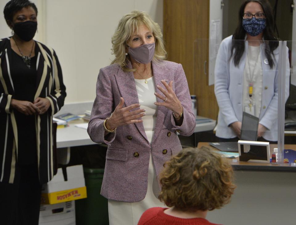 First lady Jill Biden talks to Fort LeBoeuf Middle School students while touring classrooms on March 3, 2021, in Waterford, Pa. She is flanked by Becky Pringle, National Education Association president, left, and teacher Marlee Jones.