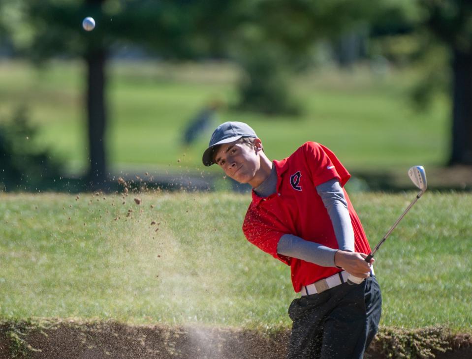 Carter Stevenson of Pekin chips out of the sandtrap during the Mid-Illini Boys Golf Championship on Thursday, Sept. 23, 2021 at Pine Lakes Golf Course in Washington.