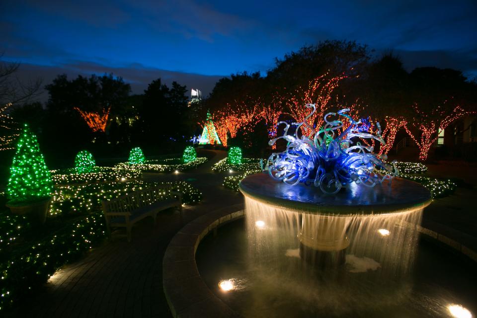FILE - During Garden Lights, Holiday Nights at the Atlanta Botanical Garden, visitors can meander through the 30-acre grounds, hot beverage in hand, admiring the millions of lights scattered in displays throughout.