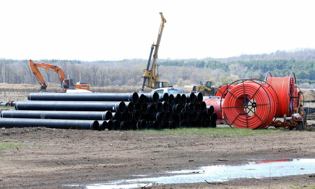 Crews perform excavation work Tuesday, April 9, 2024, on Fillmore Road west of Larrison Boulevard near New Carlisle.