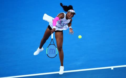 Venus Williams sends down a serve against Halep - Credit: Getty Images