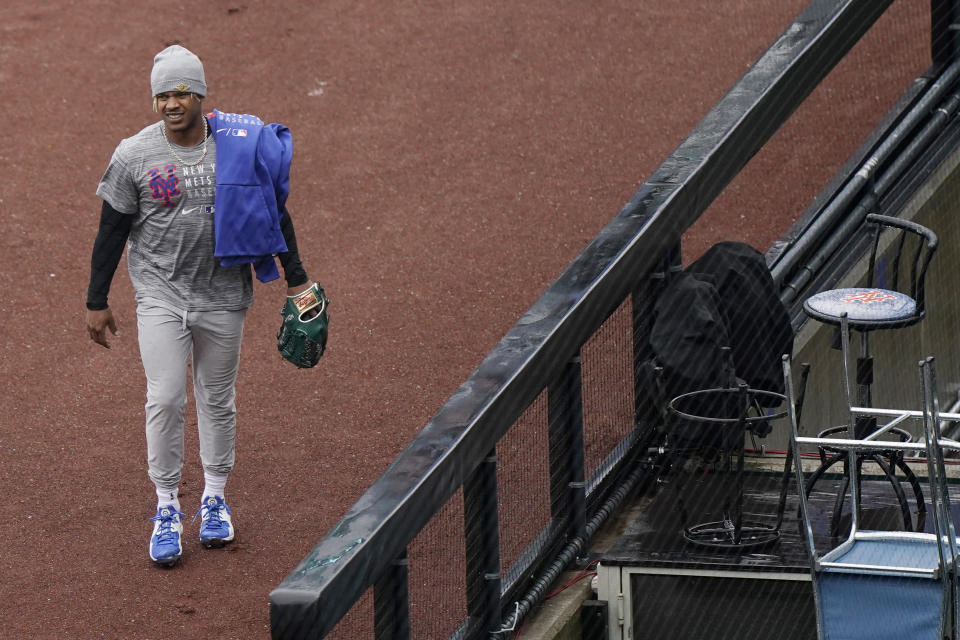 New York Mets pitcher Marcus Stroman leaves the field after working out before a baseball game against the Atlanta Braves was postponed due to rain, Sunday, May 30, 2021, in New York. (AP Photo/Kathy Willens)