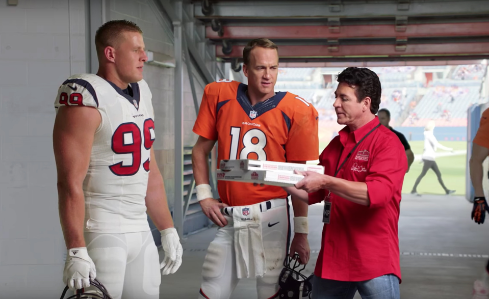 Papa John’s founder and chairman John Schnatter (R) with JJ Watt (L) and Peyton Manning in a Papa John’s commercial. (via screenshot)