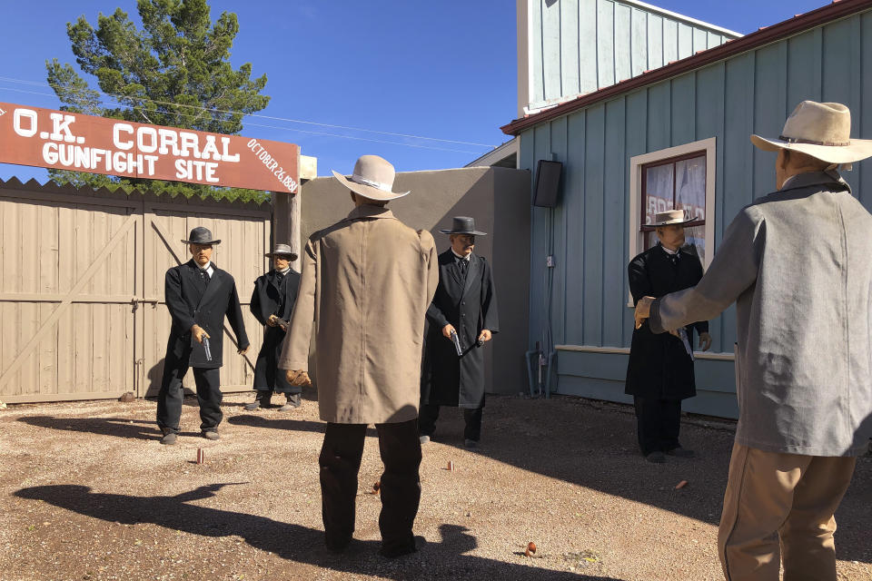 Life-sized replicas of the men who took part in a famous shootout in Tombstone, Ariz., are seen at the OK Corral in Tombstone on Saturday, Nov. 30, 2019. The men, lawmen and cowboys, are positioned as they were during the confrontation that left three dead and became one of the most famous shootouts in the Old West. (AP Photo/Peter Prengaman)