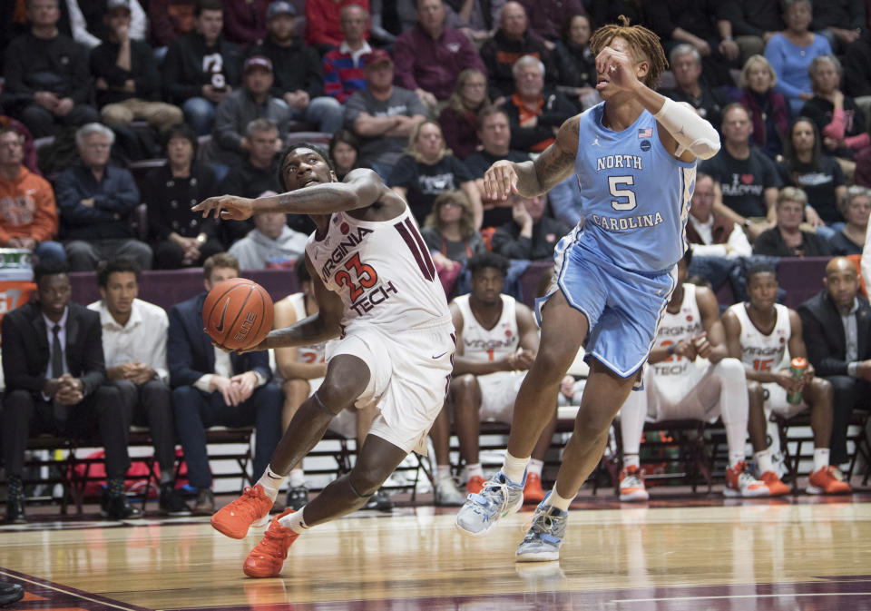 Virginia Tech guard Tyrece Radford (23) drives past North Carolina defender Armando Bacon (5) during the second half of an NCAA college basketball game in Blacksburg, Va., Wednesday, Jan. 22, 2020.(AP Photo/Lee Luther Jr.)