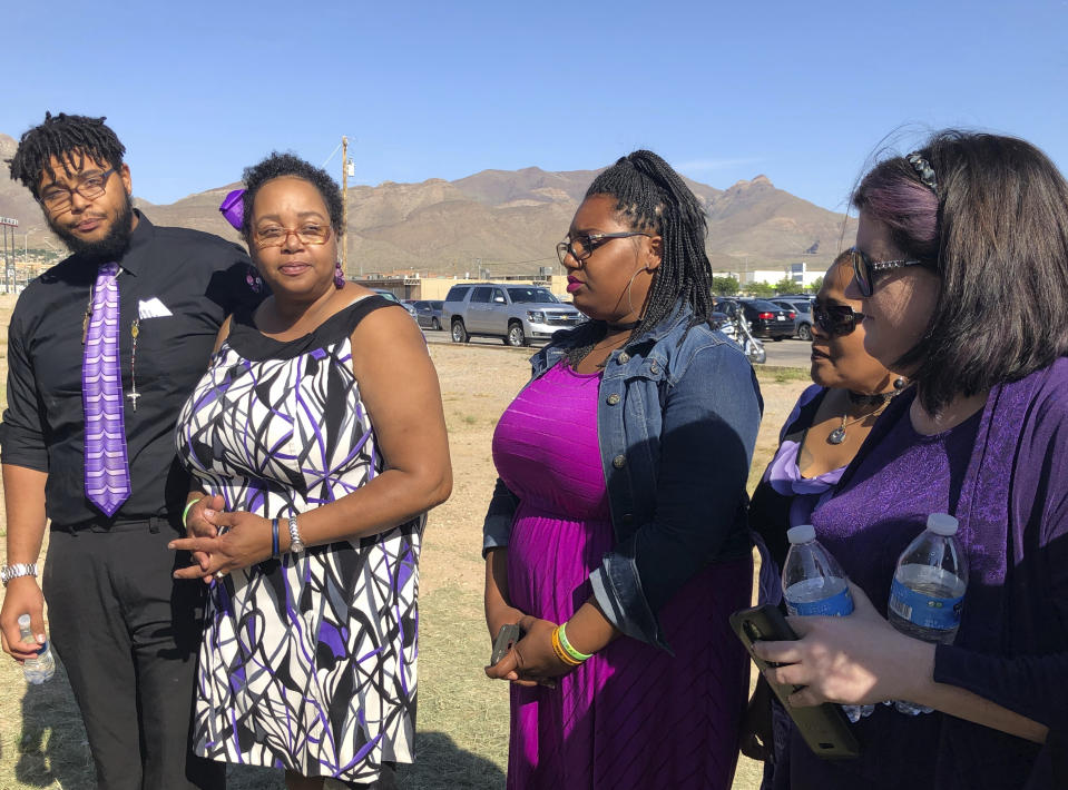 Tyler Reckard, left, 19, speaks to reporters on Saturday, Aug. 17, 2019, in El Paso, Texas, along side other family members about his grandmother, Margie Reckard, 63, before her funeral. Thousands of strangers from El Paso and around the country came to pay their respects this weekend to Reckard, who was killed by a gunman who opened fire at a Walmart in El Paso earlier this month. (AP Photo/Russell Contreras)