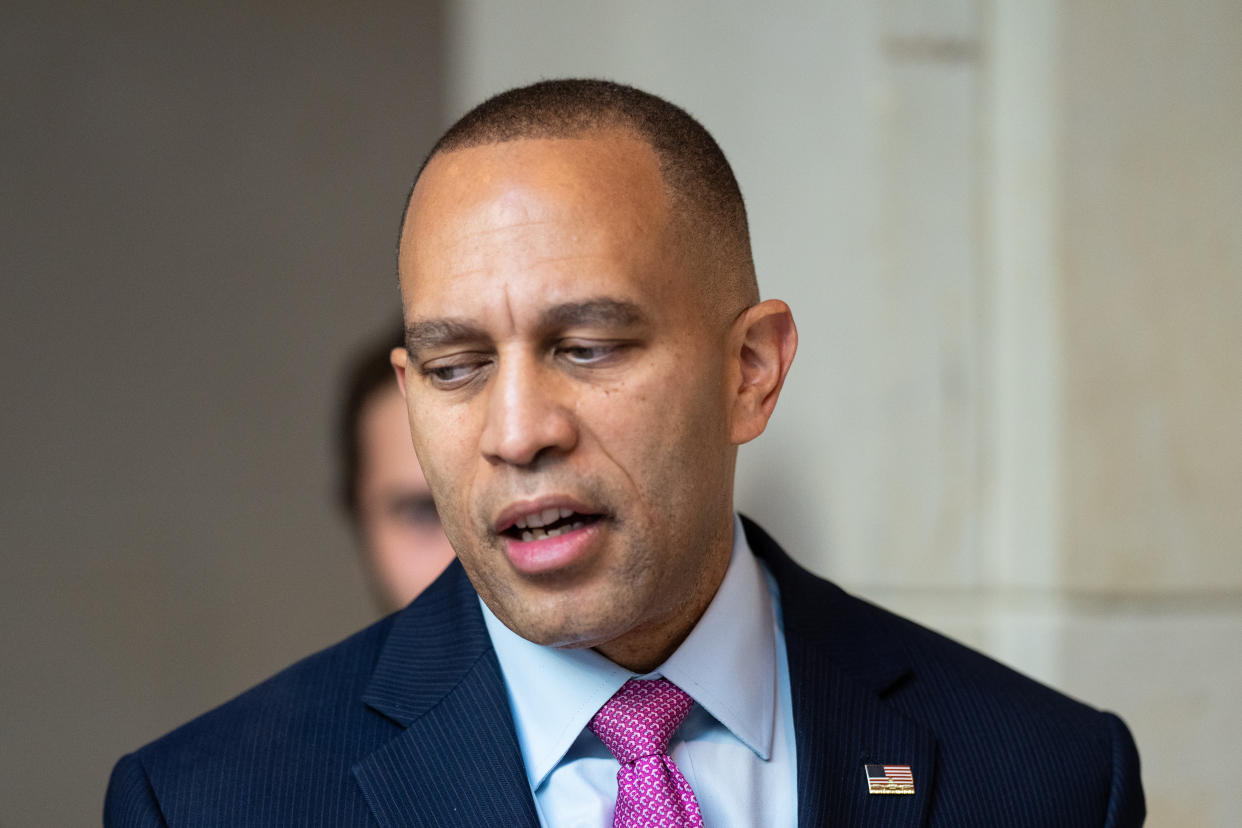 House Minority Leader Hakeem Jeffries walks in the Capitol on the way to a meeting.