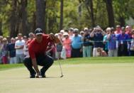 Mar 11, 2018; Palm Harbor, FL, USA; Tiger Woods lines up a putt on the 2nd during the final round of the Valspar Championship golf tournament at Innisbrook Resort - Copperhead Course. Jasen Vinlove-USA TODAY Sports