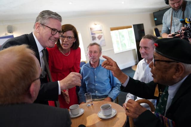 A veteran points a finger at Sir Keir Starmer while watched by Labour candidate Alex Baker and other veterans