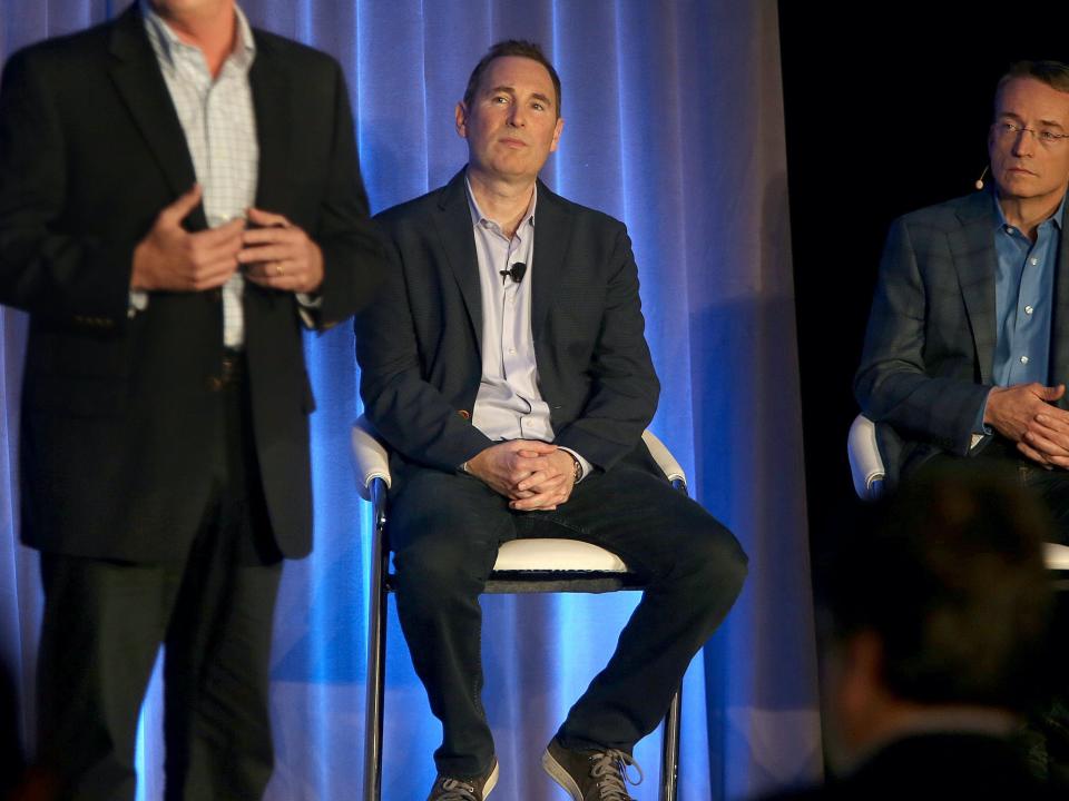 Andy Jassy seated onstage with VMware CEO Parick Gelsinger