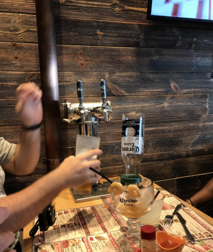 The table and beer draft are both built directly into the wall