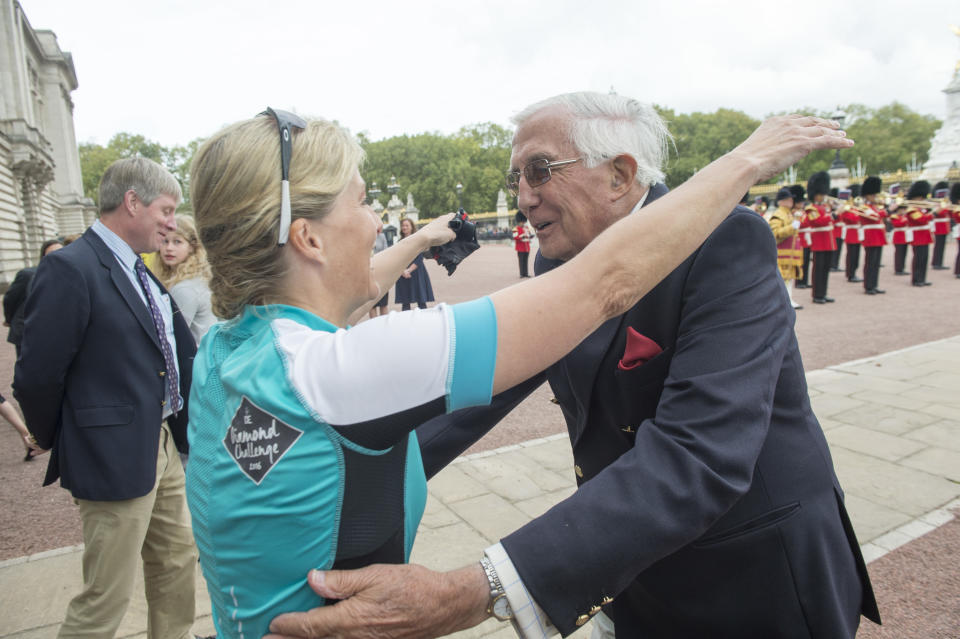 LONDON UNITED KINGDOM - SEPTEMBER 25:  Sophie, Countess of Wessex is welcomed by her Father Christopher Rhys-Jones as she arrives at Buckingham Palace having completed a cycle ride from Edinburgh on behalf of the Duke of Edinburgh's Award on September 25, 2016 in London, United Kingdom.  The Countess and the other riders were presented with a Diamond Pin to mark the completion of the Diamond Challenge. The Countess of Wessex cycled 445 miles from the Palace of Holyroodhouse, Edinburgh to Buckingham Palace, London over seven days as her 'Diamond Challenge' - a special initiative marking the 60th anniversary of the Duke of Edinburgh's Award. (Photo by  Paul Grover - WPA Pool/Getty Images)