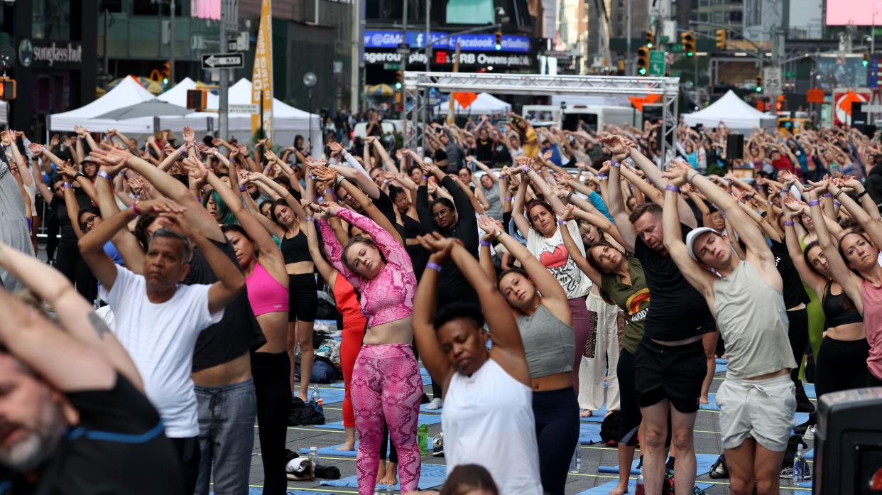 Thousands of yoga participants take part in Solstice in Times Square: Mind Over Madness Yoga in Manhattan, New York on Tuesday, June 21, 2022.