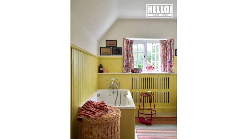 Penelope Chilvers' yellow wood pannelled bathroom at Cotswolds home