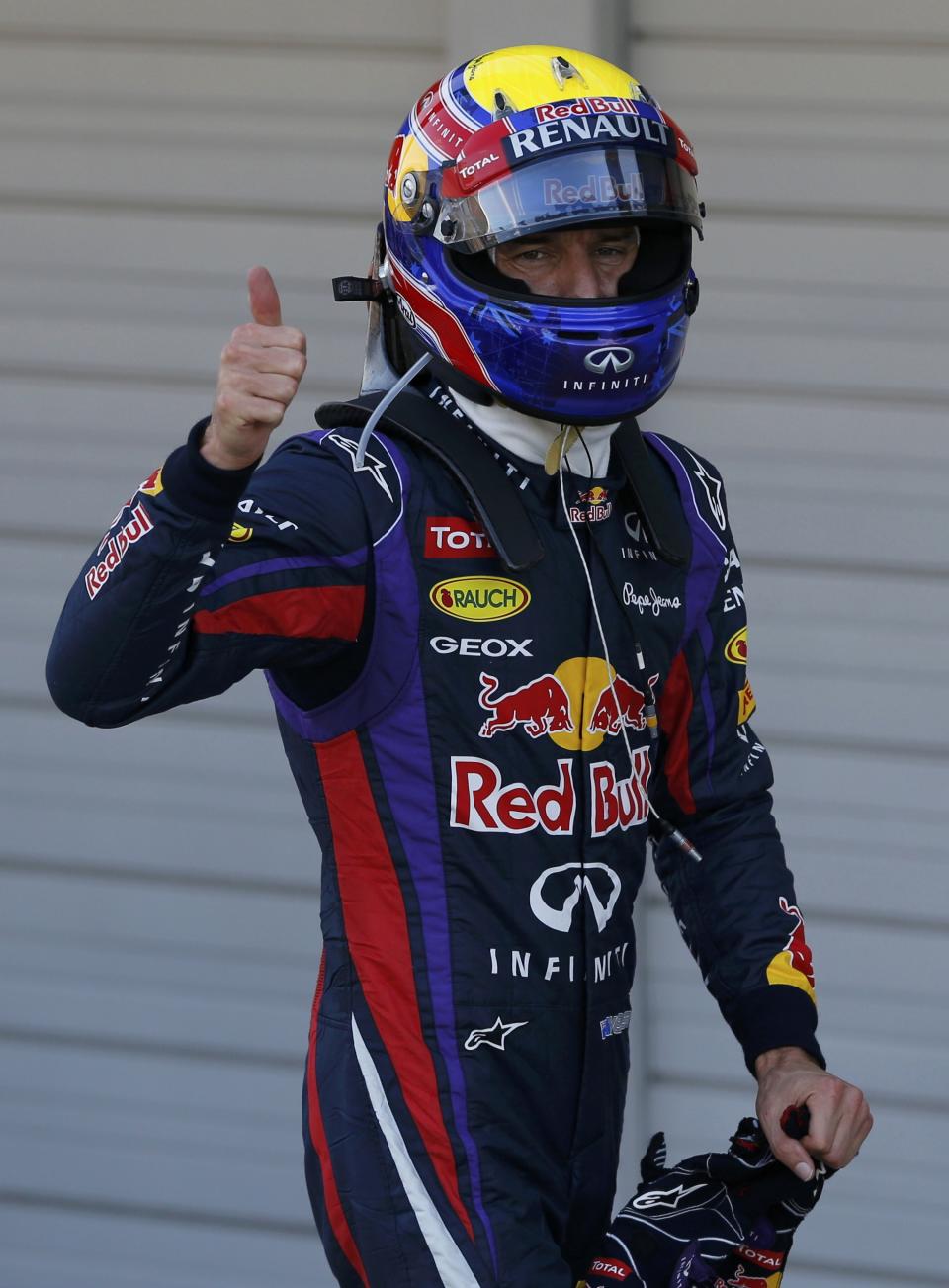 Red Bull Formula One driver Mark Webber of Australia celebrates taking pole position after the qualifying session of the Japanese F1 Grand Prix at the Suzuka circuit October 12, 2013. REUTERS/Issei Kato (JAPAN - Tags: SPORT MOTORSPORT F1)